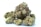Several dense cannabis buds with visible trichomes and vibrant hues ranging from green to purple. The texture is rich with orange pistils woven throughout the surface, creating a frosty appearance.
