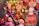 A collection of colorful handmade dolls with smiling faces and vibrant outfits. The dolls display various braided hairstyles with bright ribbon decorations. Each doll is uniquely dressed in traditional, intricately patterned clothing that adds charm and character to their appearance.
