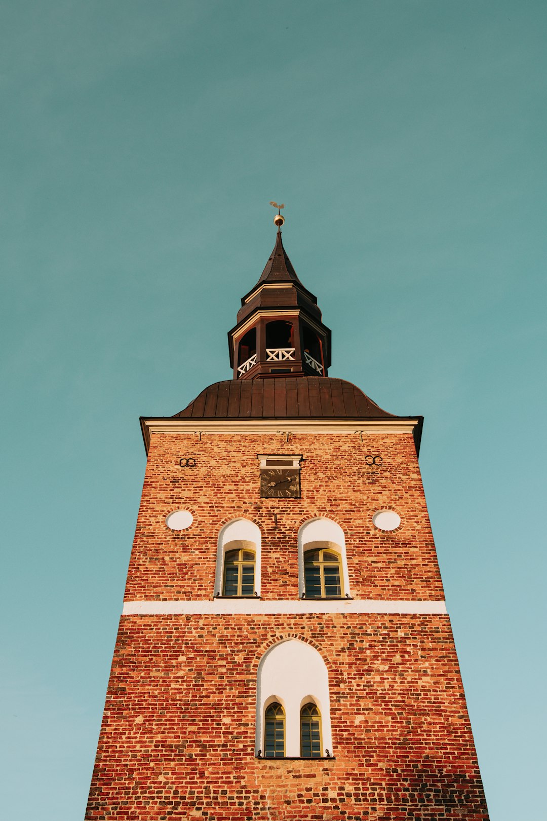 brown brick building under blue sky during daytime