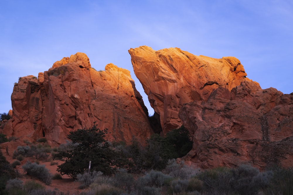 brown rock formation under blue sky during daytime