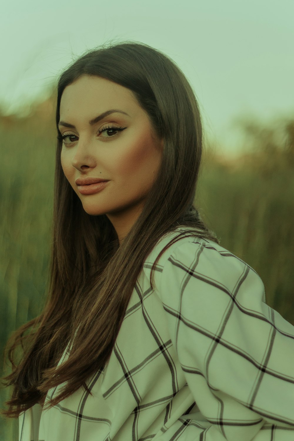 woman in white and black stripe shirt