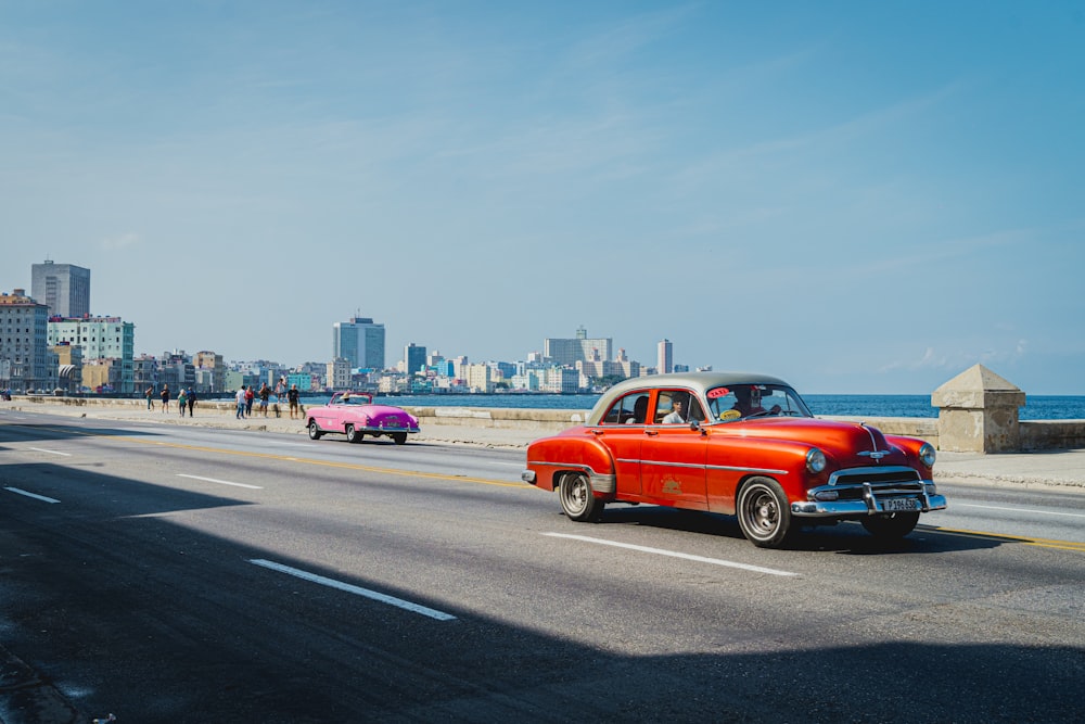 red car on road during daytime