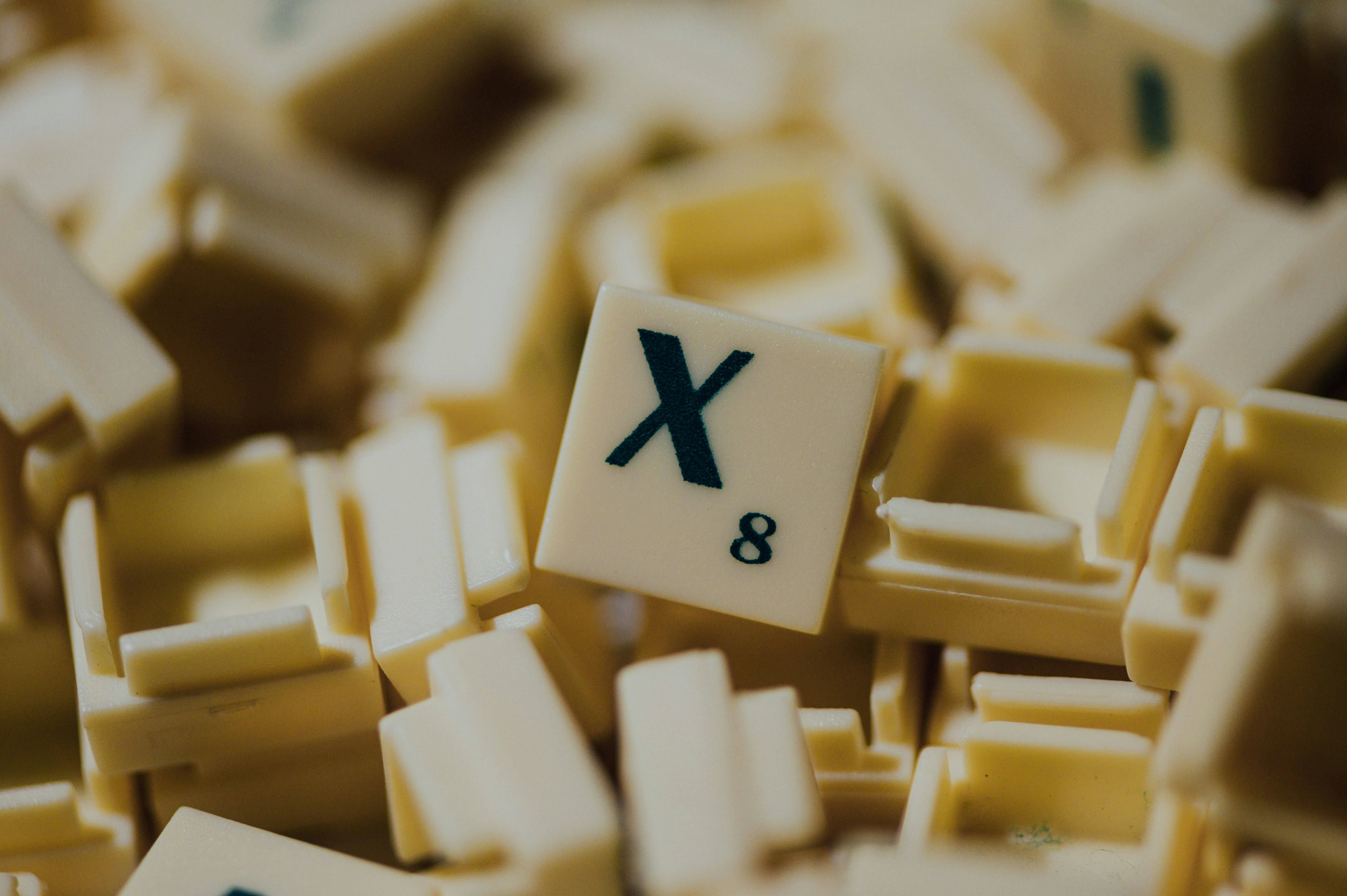 white and black cross on yellow and white blocks