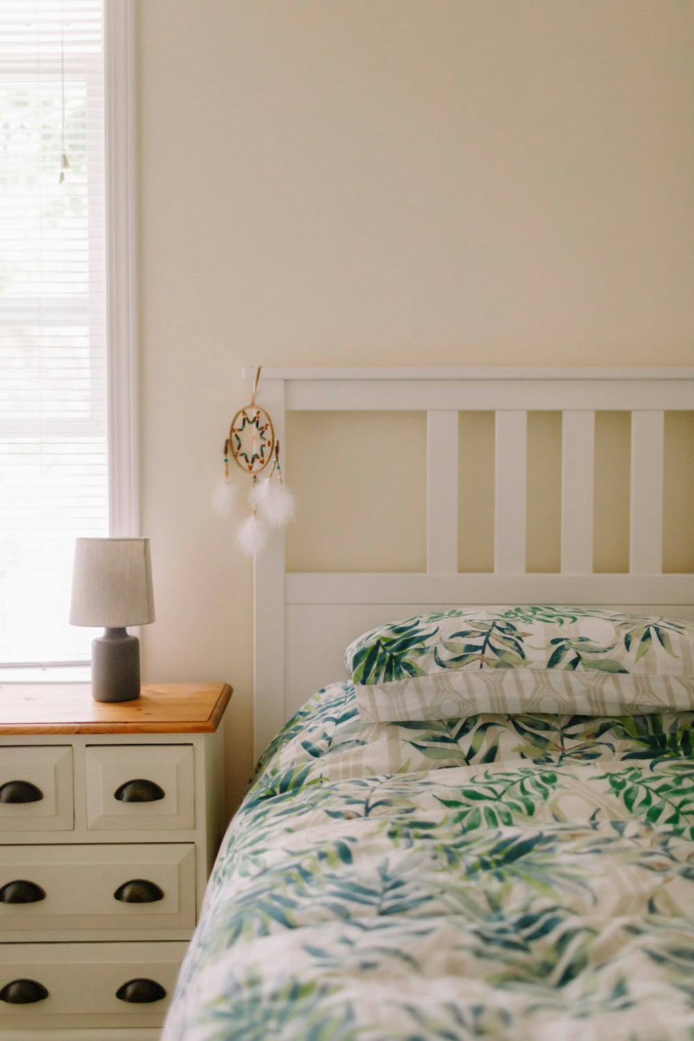 white and green floral bed linen