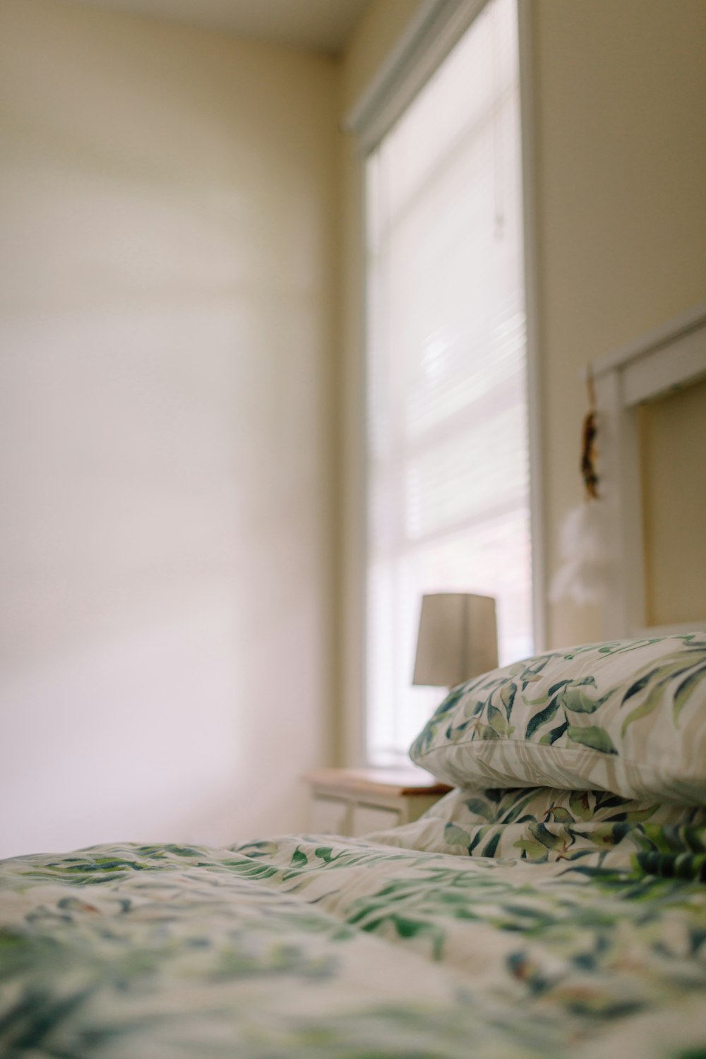 white and green floral bed linen