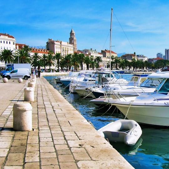 white and blue boats on dock during daytime in Split Croatia
