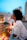 woman in white collared shirt looking at the city during night time