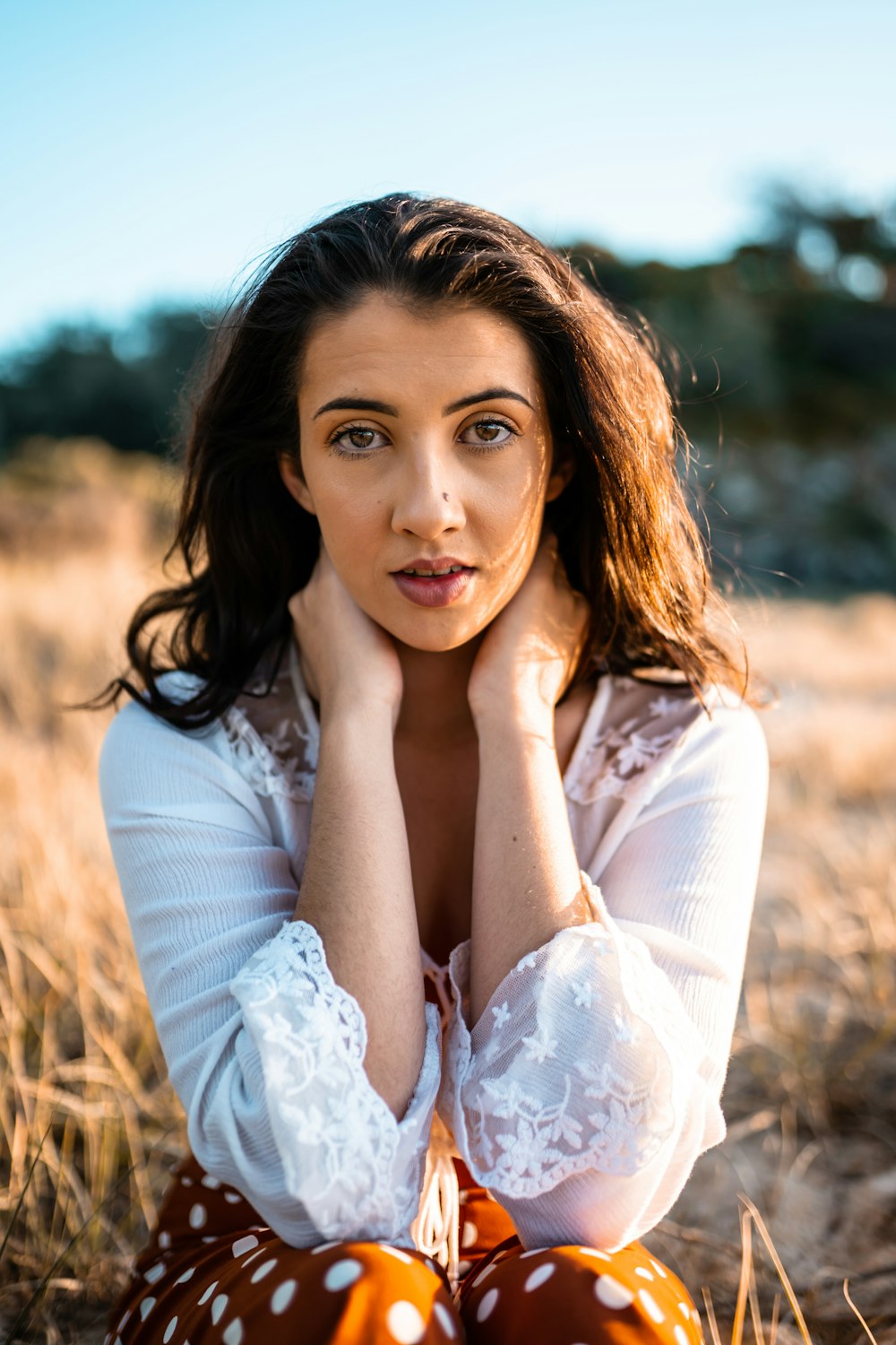 woman in white long sleeve shirt