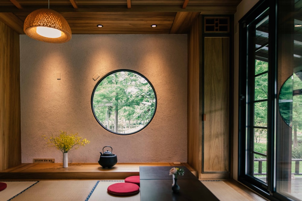 brown wooden table near window