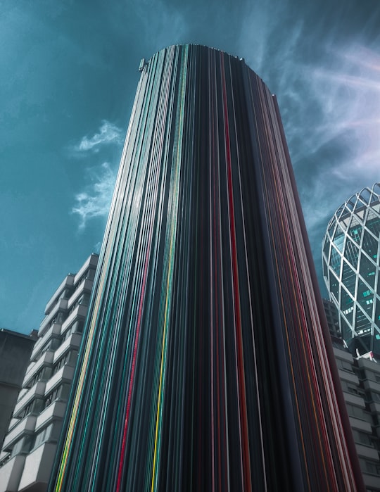 blue and red glass walled high rise building in Puteaux France