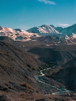 brown and green mountains under blue sky during daytime