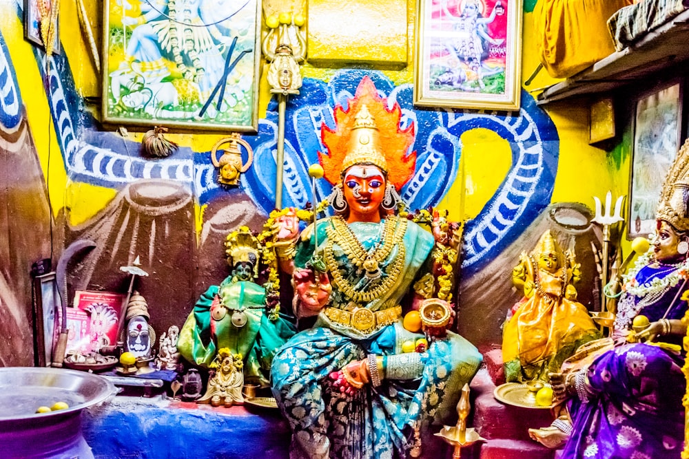 hindu deity sitting on chair
