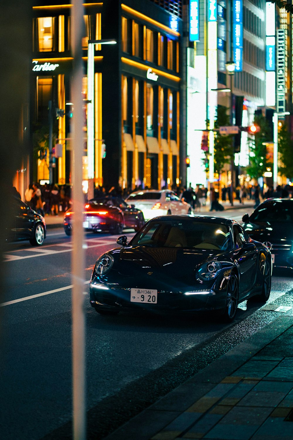 black porsche 911 parked on road during daytime