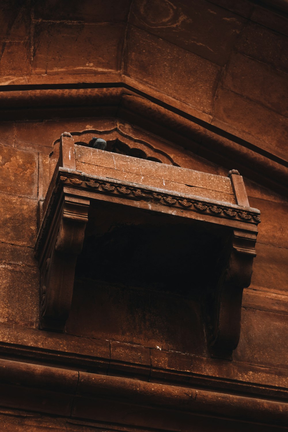 brown concrete brick wall with brown wooden door