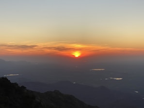 A breathtaking sunrise over the salt flats of Kutch, warming the horizon in amber hues.