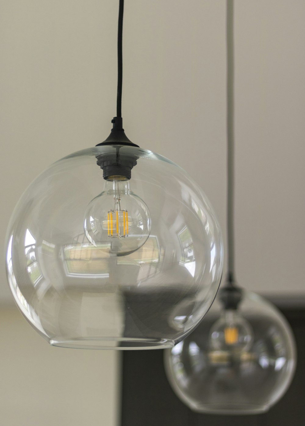 clear glass ball with black and white stick inside