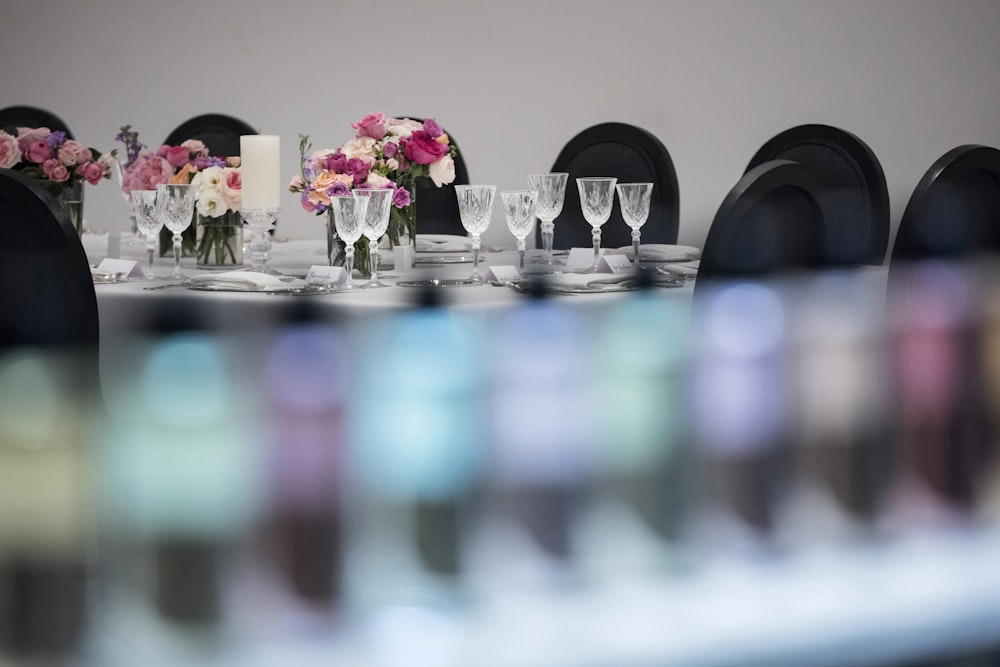 pink and white roses in clear glass vase on table