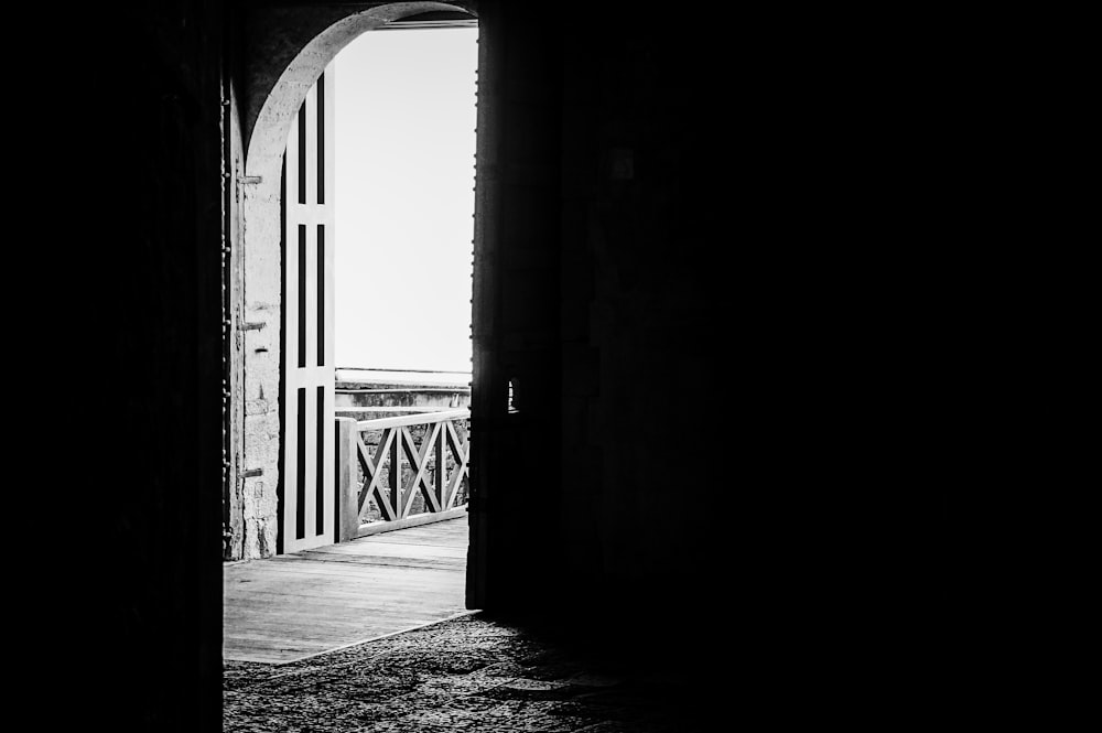 grayscale photo of a bridge