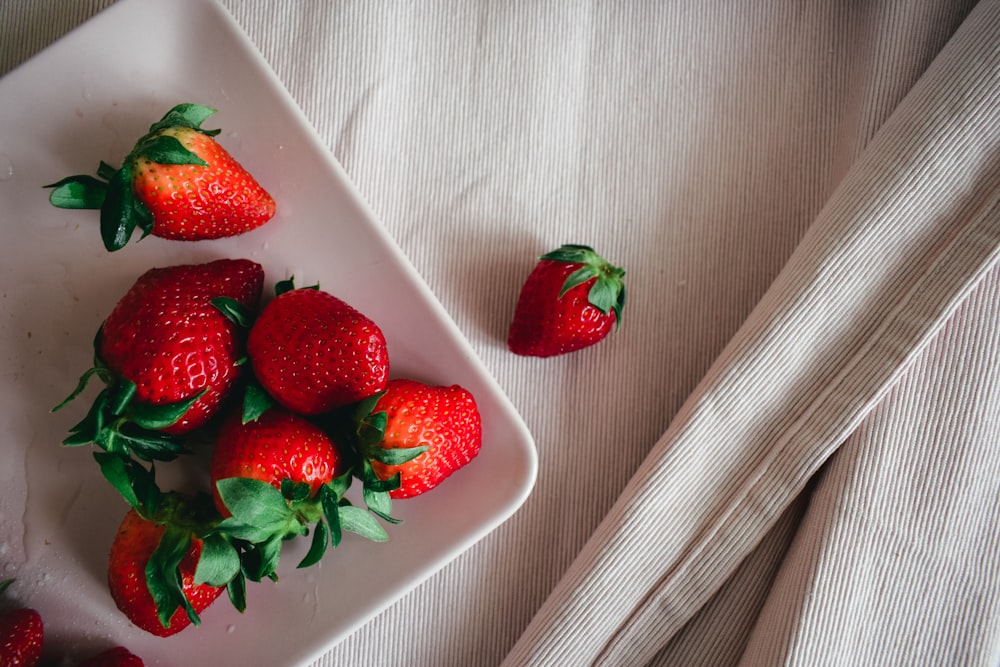 strawberries in white ceramic bowl