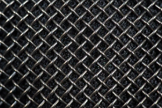 Close-up of stainless steel round filter mesh with fine precision weaving