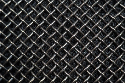 Close-up of stainless steel round filter mesh with fine precision weaving