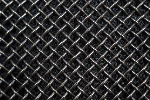 Close-up of galvanized wire mesh with a shiny silver finish, perfect for agricultural use.