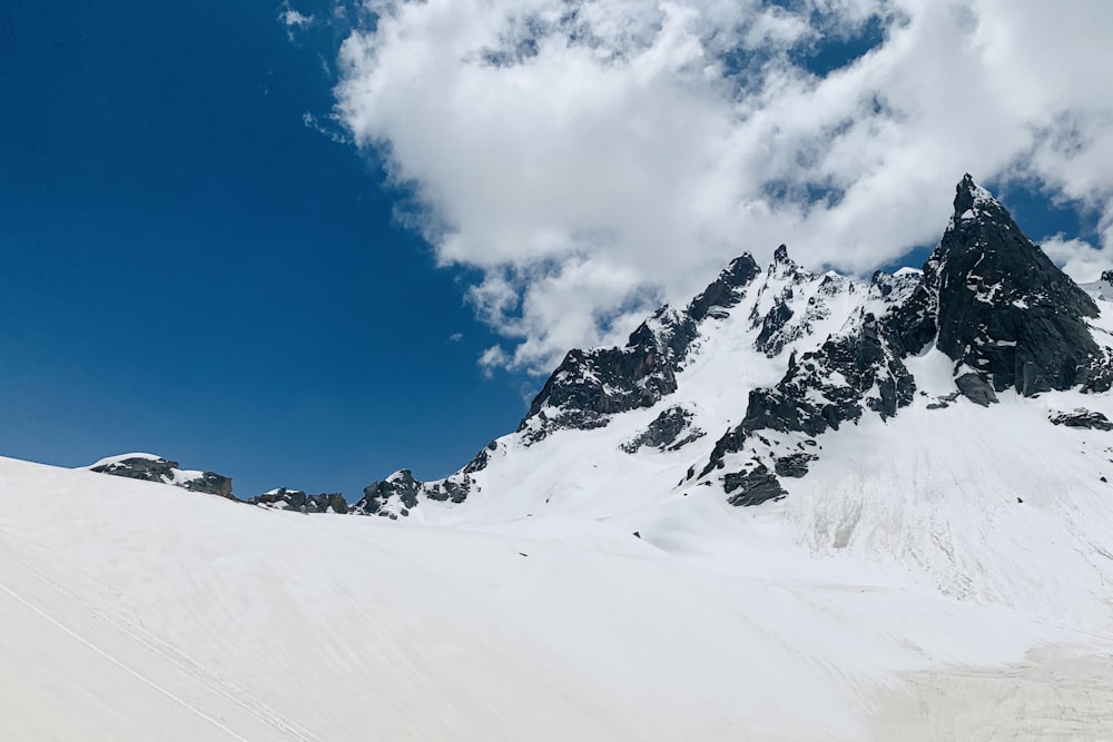 snow covered mountain under blue sky during daytime