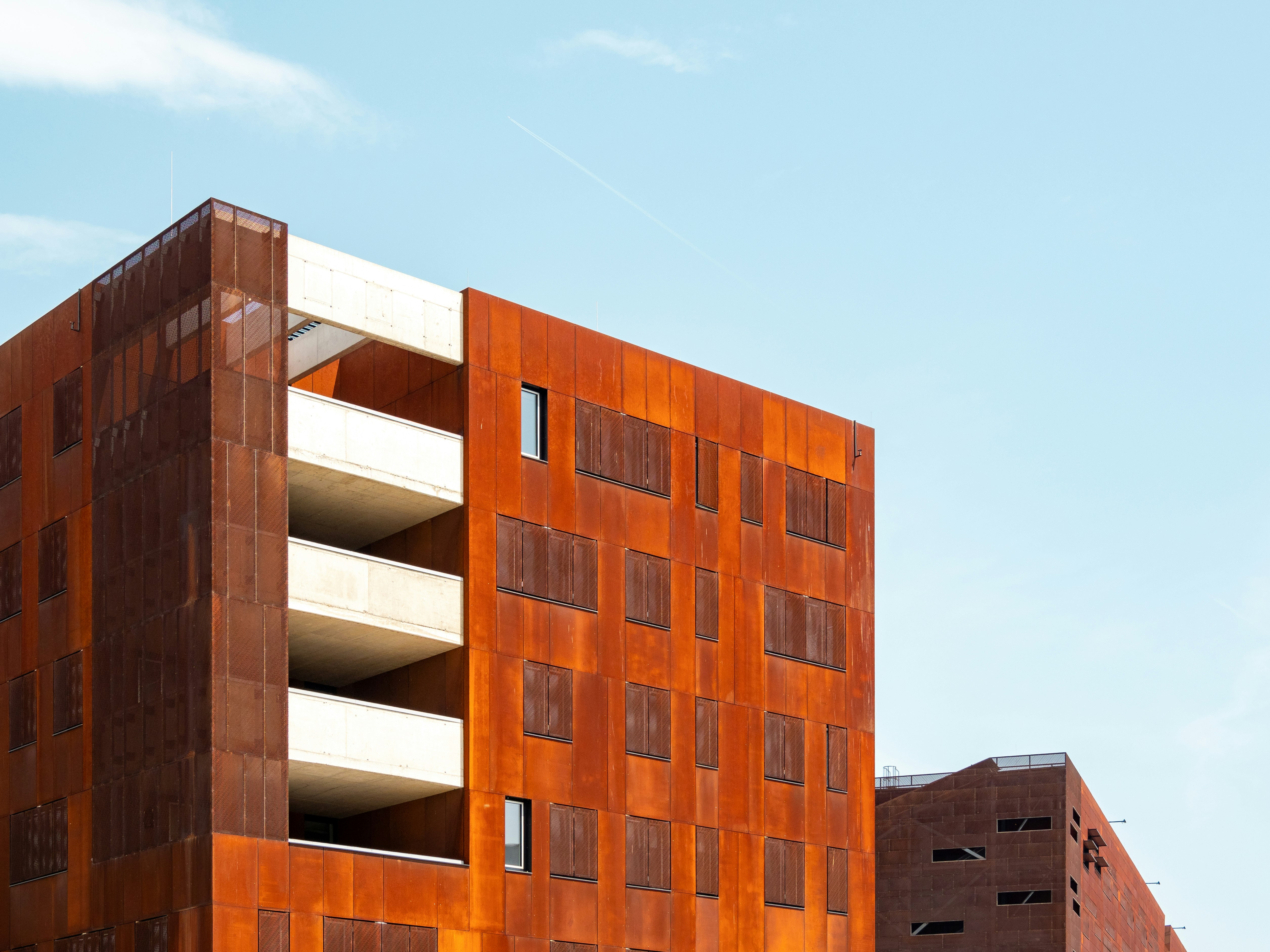 brown concrete building under blue sky during daytime