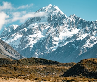 snow covered mountain under blue sky during daytime