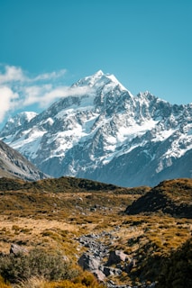 snow covered mountain under blue sky during daytime