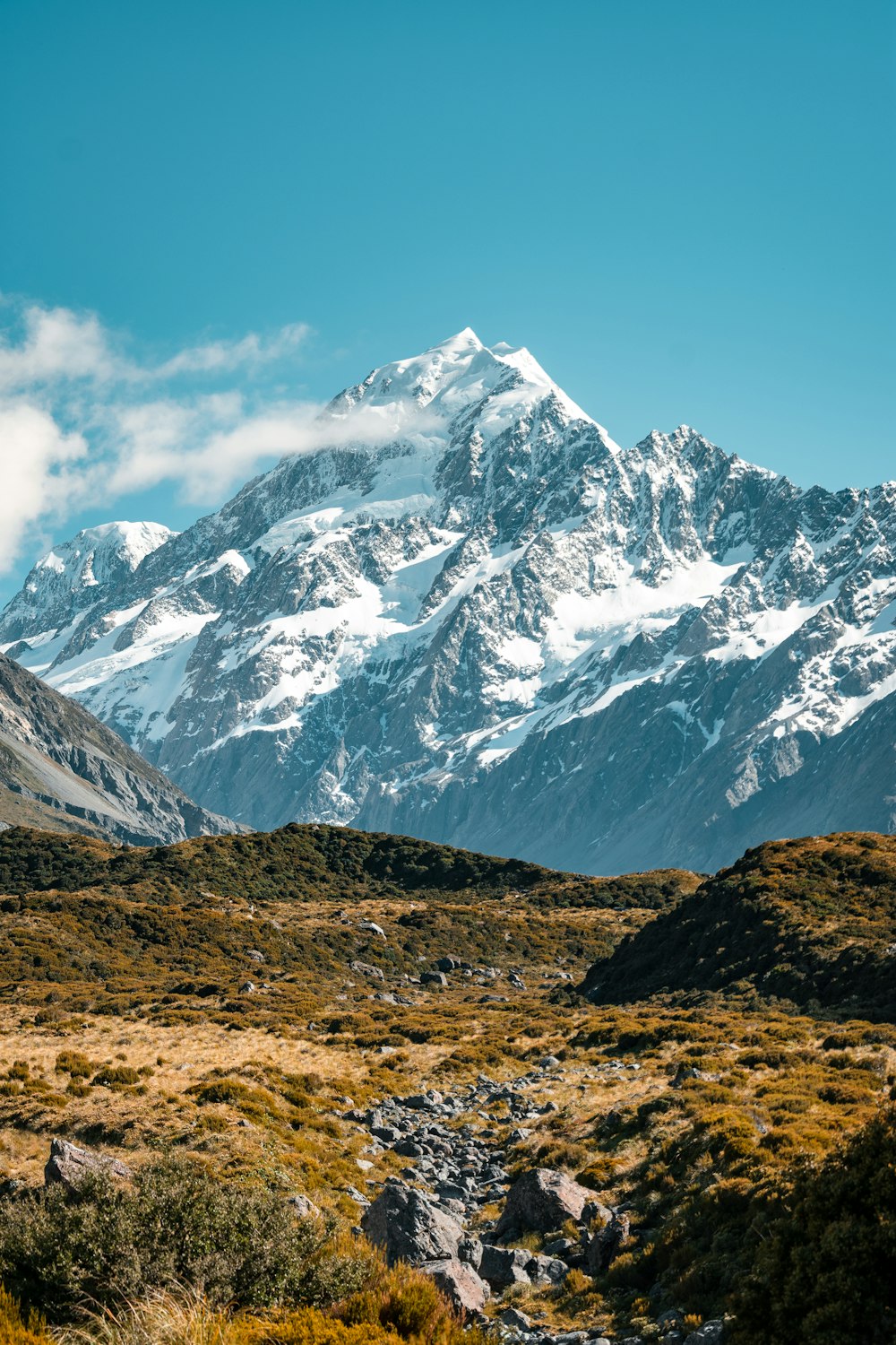 snow covered mountain under blue sky during daytime