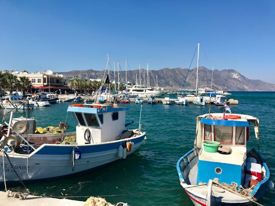 white and blue boat on sea during daytime in Kos Greece