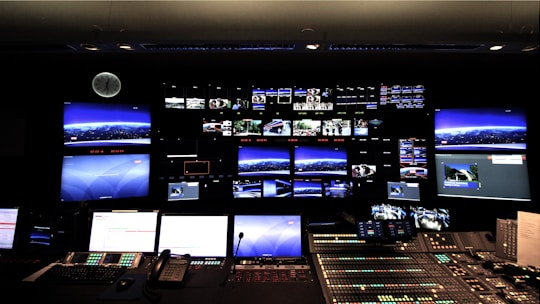 A control room with multiple monitors displaying real-time security footage.