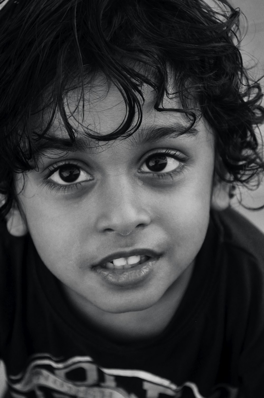 grayscale photo of boys face