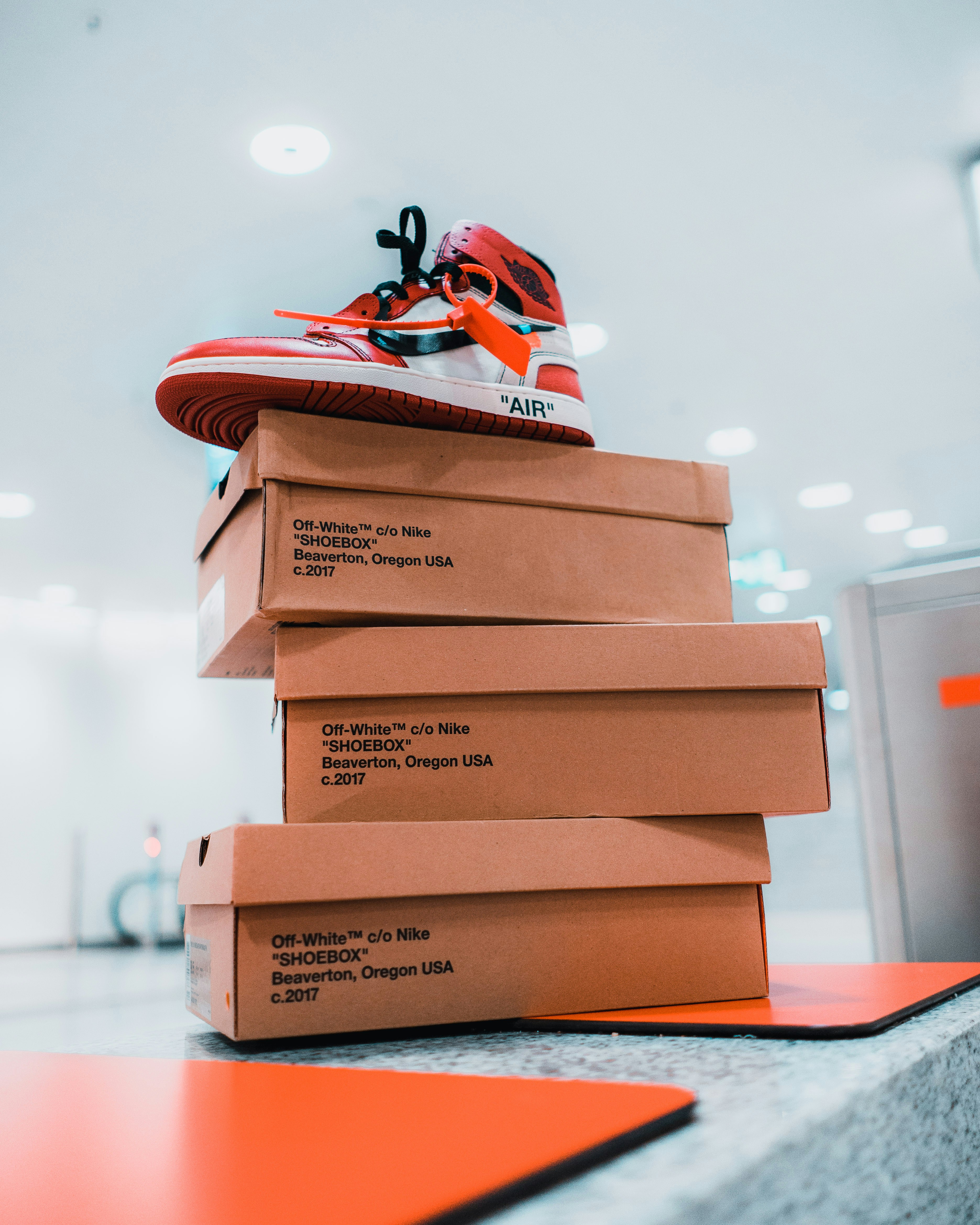 Download White Nike Shoe Box On Brown Wooden Rack Photo Free Nike Image On Unsplash