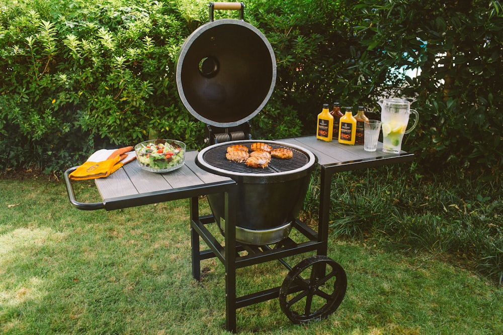 black metal round table with foods and drinks