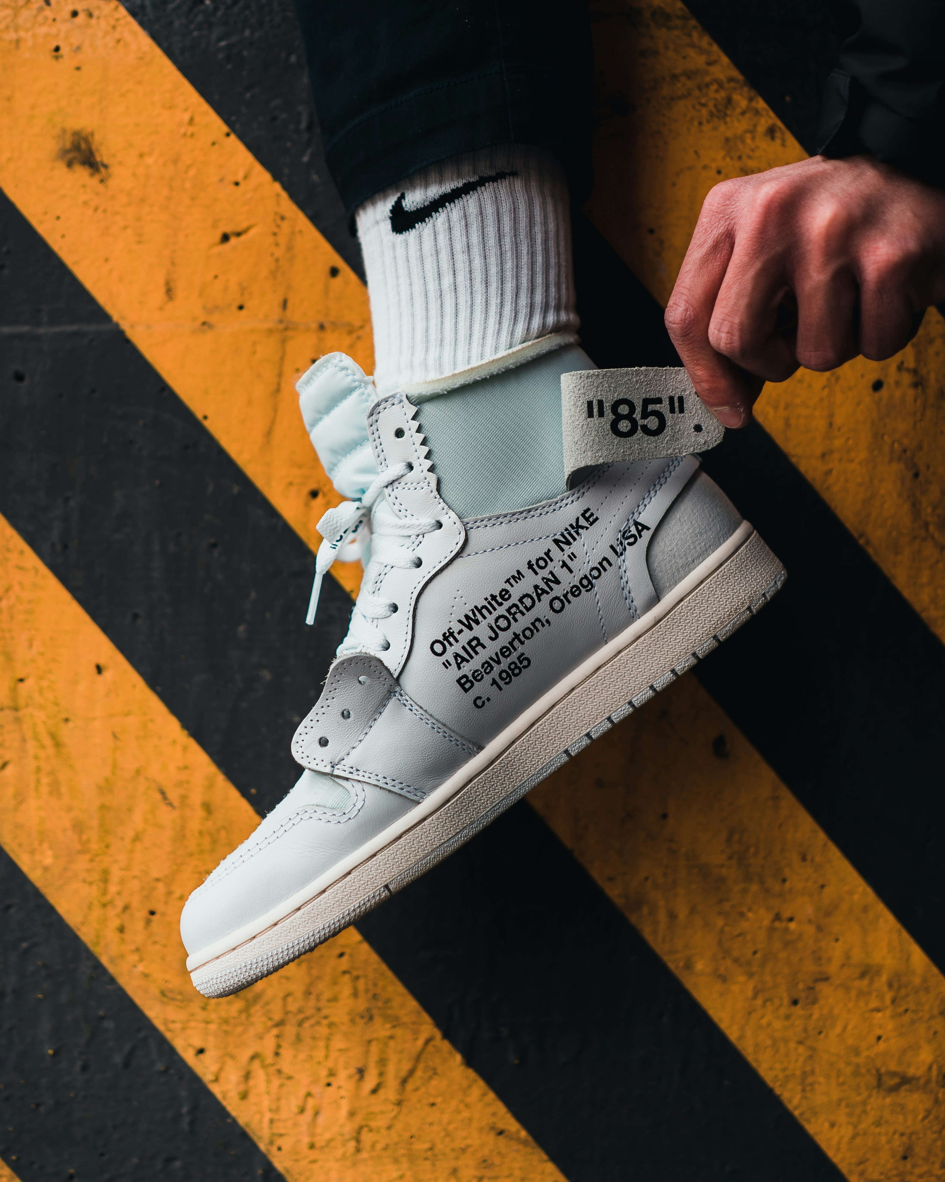 person wearing white nike air force 1 low