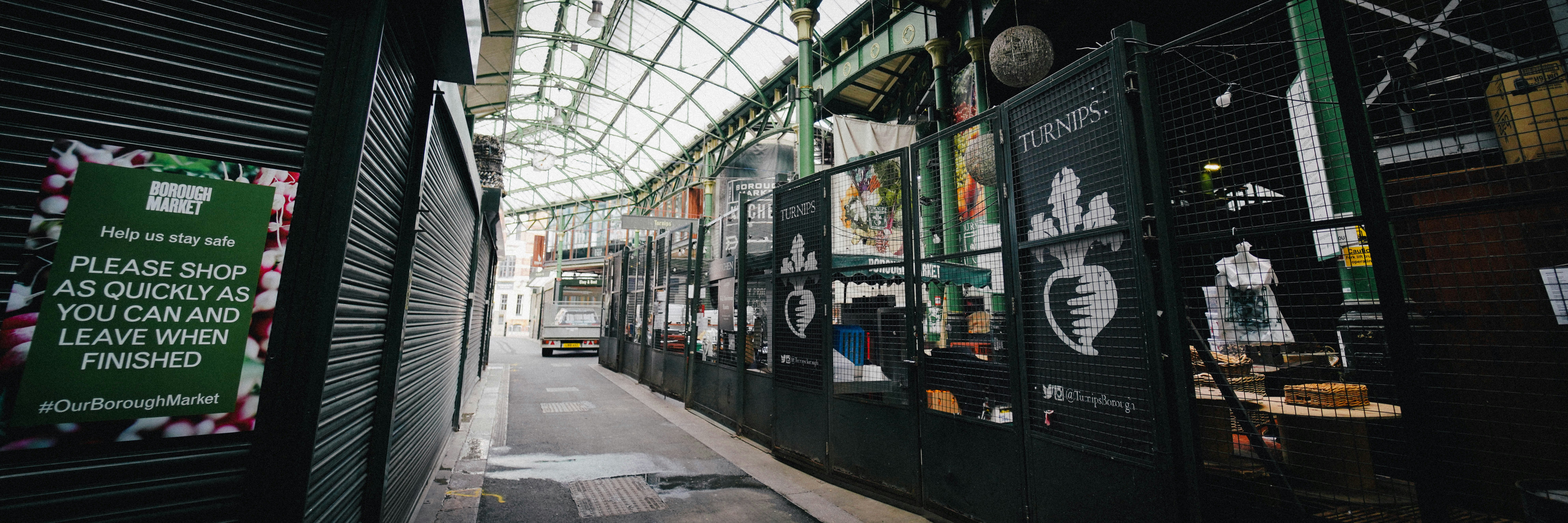 black metal fence near white train during daytime, Borough Market, London