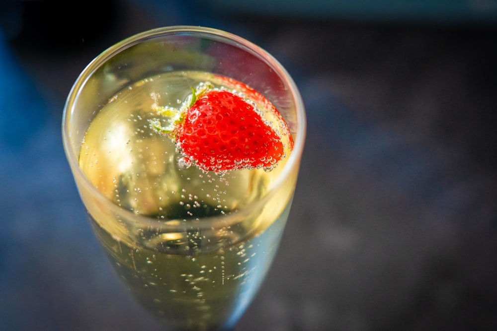 clear drinking glass with red liquid