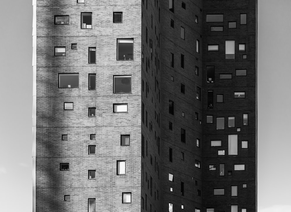 a black and white photo of two tall buildings