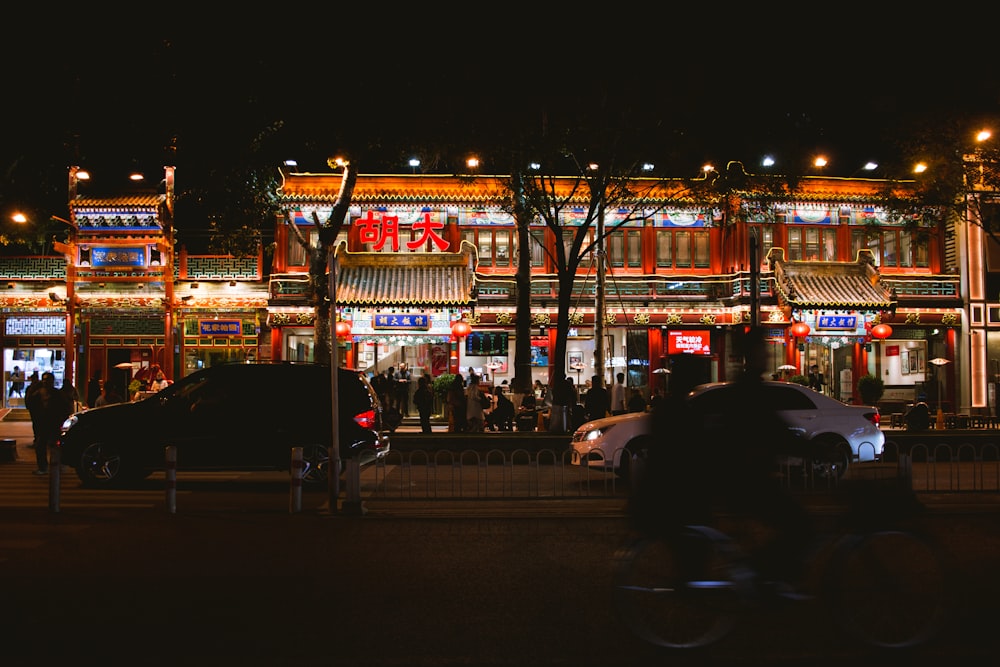 cars parked near building during night time