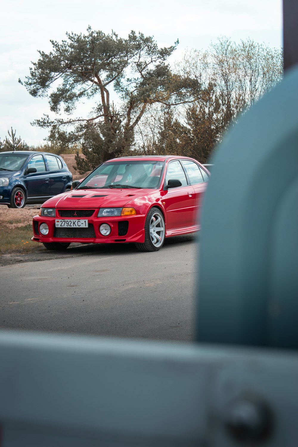 red bmw m 3 on road