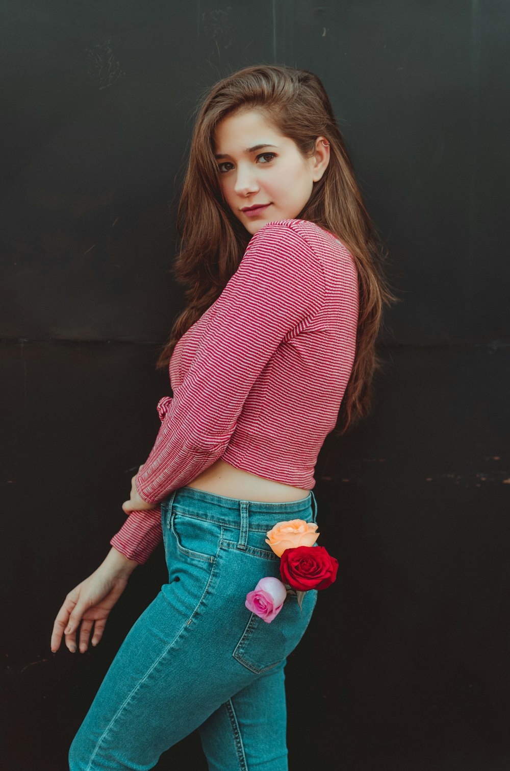 woman in red sweater and blue denim jeans