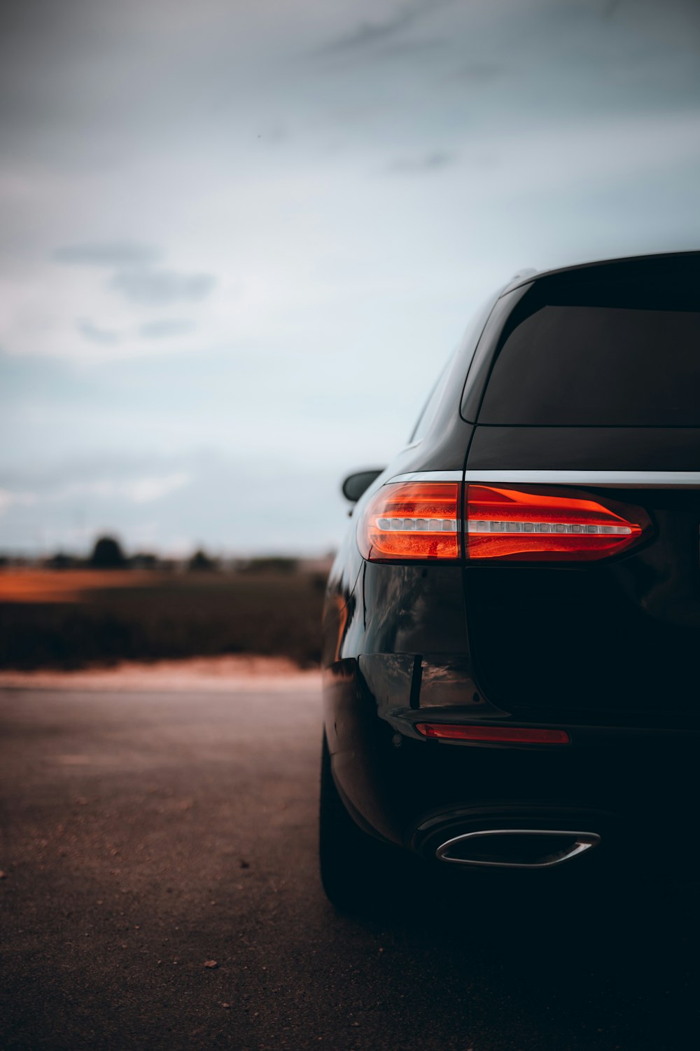 black car on brown sand during daytime