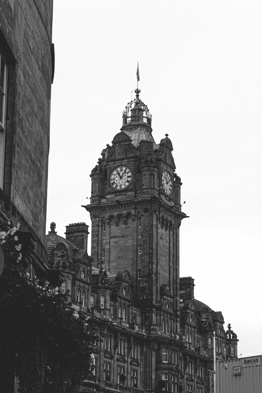 grayscale photo of clock tower