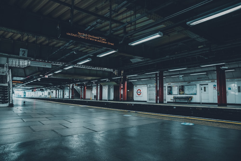 white and red train in train station