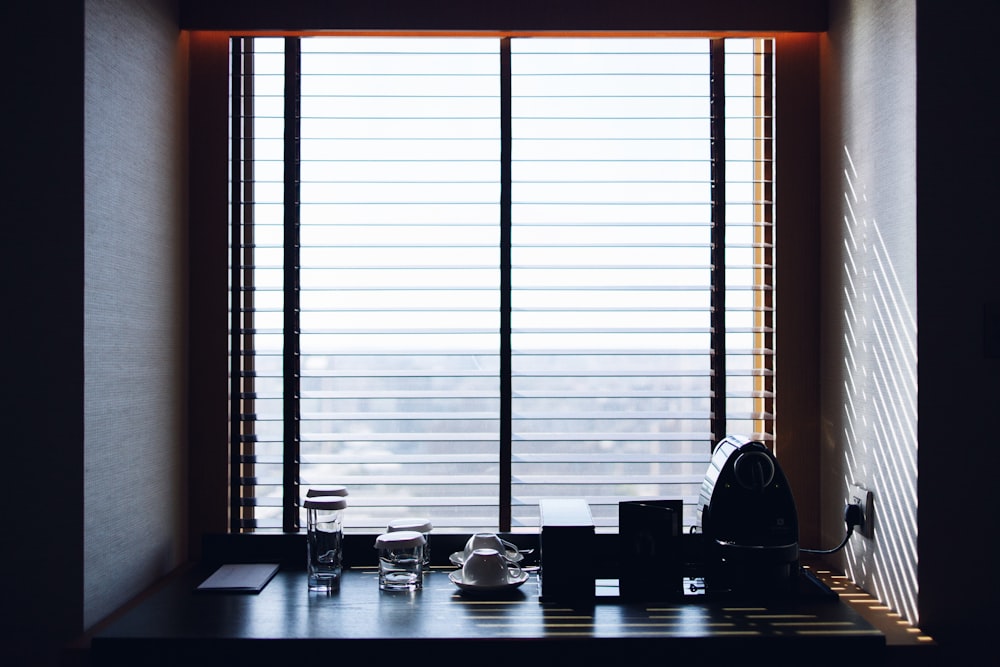 black wooden table near window