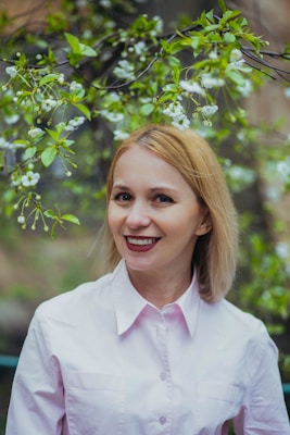 smiling woman in white dress shirt
