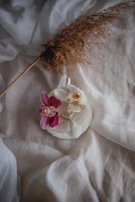 An elegant arrangement of personalized event candles with soft ribbons and rustic tags.