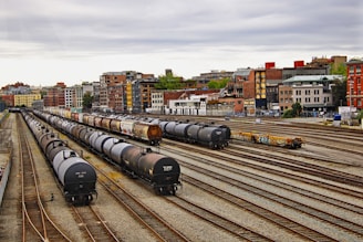 black train on rail road during daytime